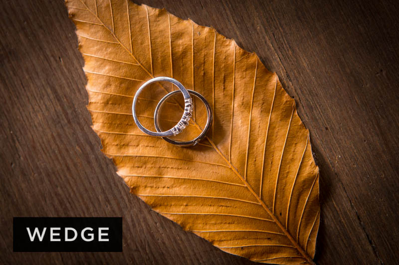 Wedding rings on autumn leaf.
