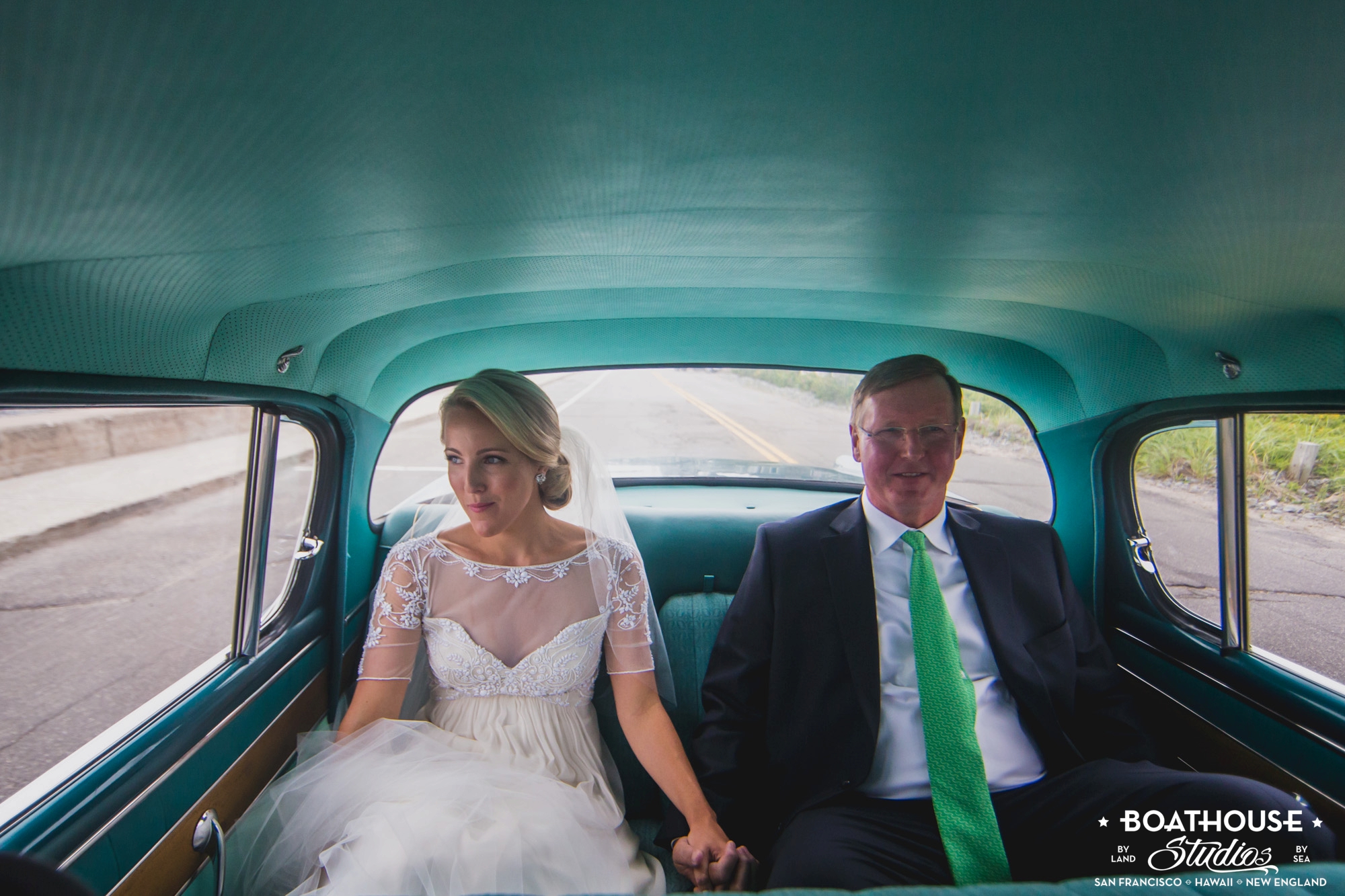 Quiet moment in the antique car driving to the wedding ceremony.
